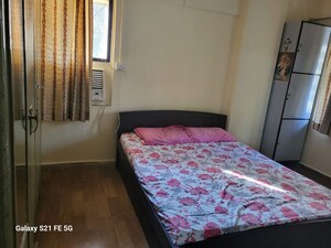 Bedroom in 2 BHK Apartment at Asha Nagar CHS, Mulund West – for Sale