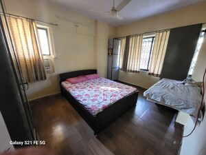 Bedroom in 2 BHK Apartment at Asha Nagar CHS, Mulund West – for Sale