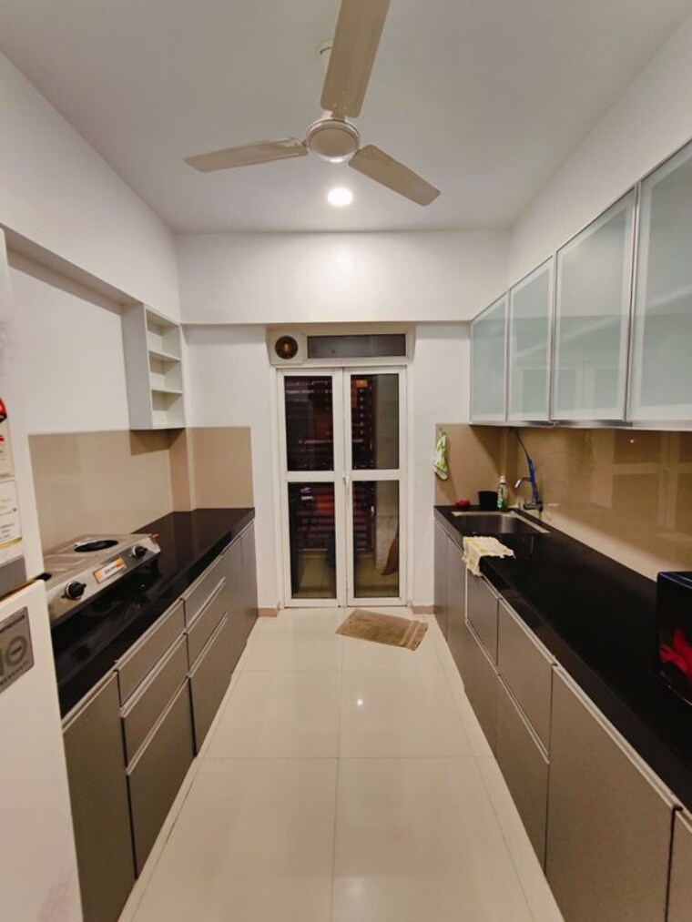 Kitchen, lodha-belmondo 1 Bedroom 711 Sq.Ft. Apartment In Gahunje Pune 10205725