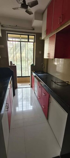 Kitchen in 2 BHK Apartment at Vasant Sagar, Kandivali East – for Sale