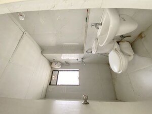 Bathroom in 1 BHK Apartment at Runwal Gardens, Dombivli East – for Rent