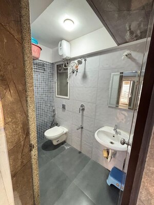 Bathroom in 1 BHK Apartment at Shraddha Vertica, Vikhroli East – for Rent