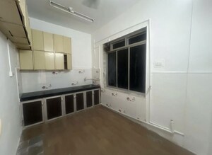 Kitchen in 2 BHK Apartment at Shyam Niwas CHS, Cumbala Hill – for Sale