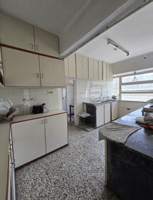 Kitchen in 3 BHK Apartment at Ananta Apartment, Cumbala Hill – for Sale