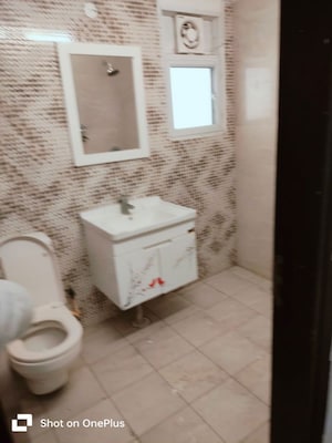 Bathroom in 3 BHK Apartment at Elite Golf Green, Sector 79 – for Rent