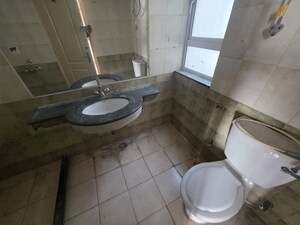 Bathroom in 4 BHK Apartment at Orchid Petals, Sector 49 – for Sale