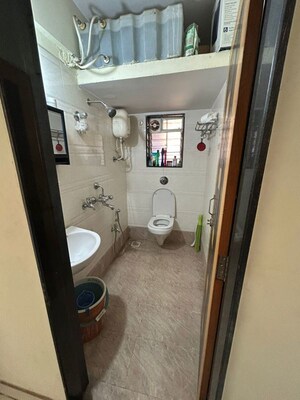 Bathroom in 1 BHK Apartment at Harsh CHS Tilak Nagar, Tilak Nagar – for Rent