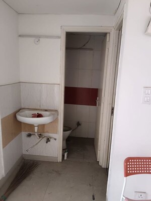 Bathroom in 2 BHK Apartment at Raj Nagar Extension – for Sale