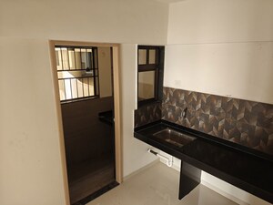 Kitchen in 2 BHK Apartment at Kohinoor Courtyard One, Wakad – for Rent