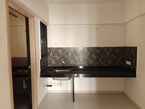 Kitchen in 2 BHK Apartment at Kohinoor Courtyard One, Wakad – for Rent