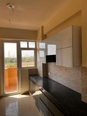 Kitchen in 4 BHK Apartment at Ansal Highland Park, Sector 103 – for Rent