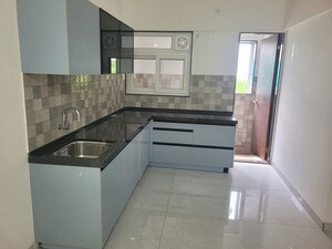 Kitchen in 3 BHK Apartment at D And T Mountain View CHS, Senapati Bapat Road – for Sale