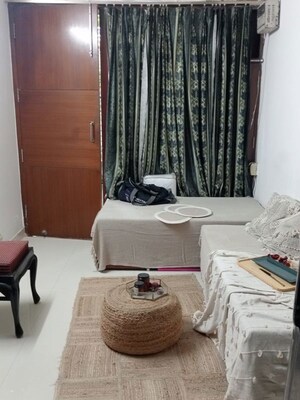 Living Room in 2 BHK Apartment at Sikka Karmic Greens, Sector 78 – for Rent