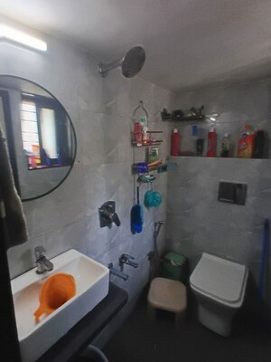 Bathroom in 2 BHK Apartment at Raunak Charnamrut CHS, Ghodbunder Road – for Rent