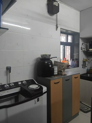 Kitchen in 2 BHK Apartment at Raunak Charnamrut CHS, Ghodbunder Road – for Rent