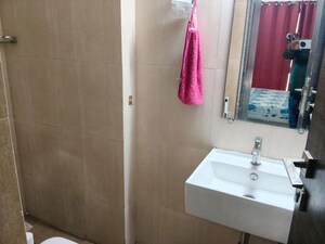 Bathroom in 1 BHK Apartment at Kanakia Rainforest, Andheri East – for Rent