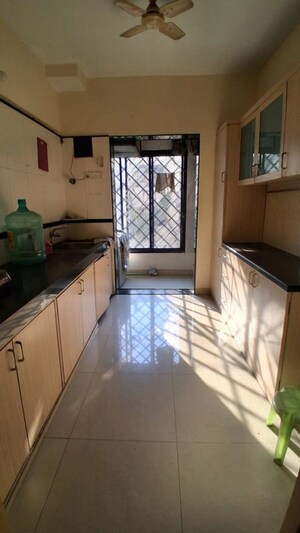 Kitchen in 2 BHK Apartment at Shikhar Kunj Malad, Malad East – for Rent