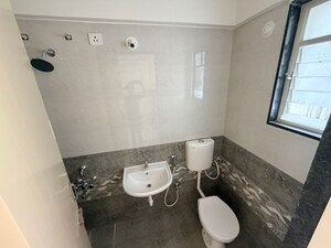 Bathroom in 2 BHK Apartment at Kohinoor Group Abhimaan, Shirgaon – for Sale