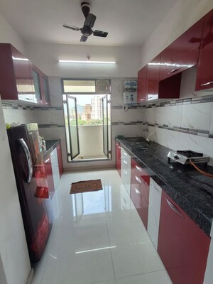 Kitchen in 2 BHK Apartment at Dynamic Crest, Shilphata – for Rent