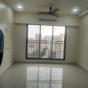 Living Room in 2 BHK Apartment at Pratham ARC Aura, Andheri West – for Rent