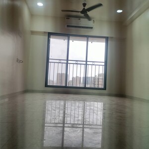 Living Room in 2 BHK Apartment at Pratham ARC Aura, Andheri West – for Rent