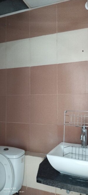 Bathroom in 3 BHK Apartment at Mahagun My Woods, Sector 16c Greater Noida – for Rent