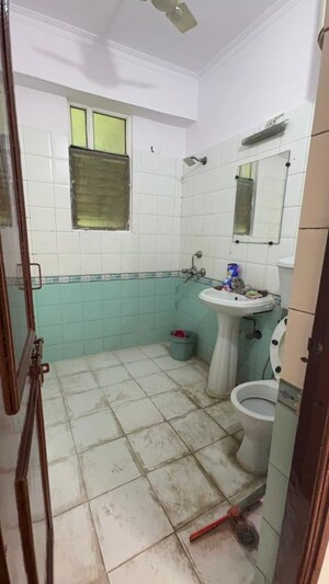 Bathroom in 3 BHK Apartment at Mahagun Mansion I and II, Vaibhav Khand – for Rent