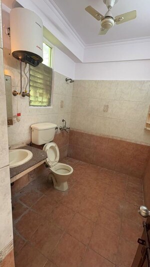 Bathroom in 3 BHK Apartment at Mahagun Mansion I and II, Vaibhav Khand – for Rent