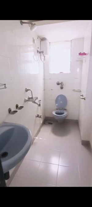 Bathroom in 2 BHK Apartment at Montreal Tower, Andheri West – for Rent