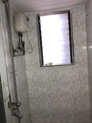 Bathroom in 1 BHK Apartment at Swati CHS, Andheri West – for Rent