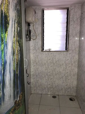 Bathroom in 1 BHK Apartment at Swati CHS, Andheri West – for Rent