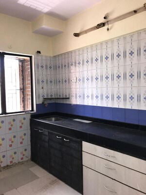 Kitchen in 1 BHK Apartment at Swati CHS, Andheri West – for Rent