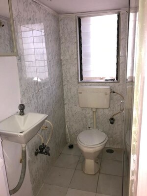 Bathroom in 1 BHK Apartment at Swati CHS, Andheri West – for Rent