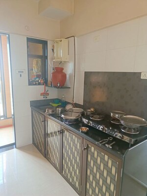 Kitchen in 2 BHK Apartment at Yogi Ratna Apartments, Borivali West – for Sale