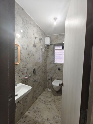 Bathroom in 1 BHK Apartment at Shraddha Panache, Tagore Nagar – for Rent