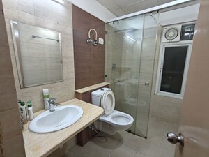 Bathroom in 3 BHK Apartment at Mahagun Moderne, Sector 78 – for Sale