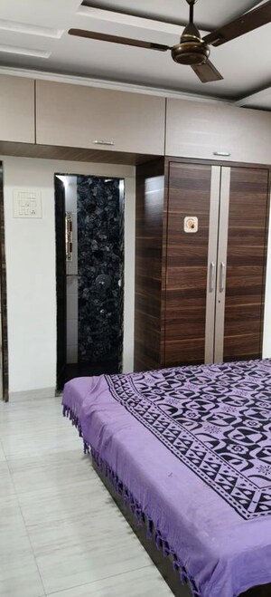 Bedroom in 2 BHK Apartment at Om Balaji Kripa CHS, Nerul Sector 19 – for Rent