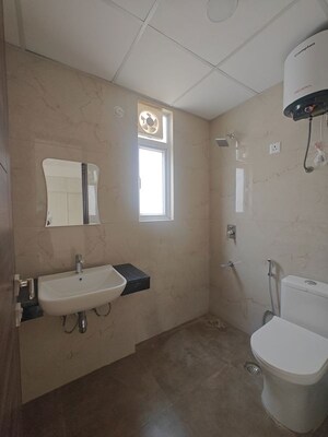 Bathroom in 3.5 BHK Builder Floor at Emaar Palm Gardens, Sector 83 – for Sale