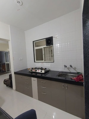 Kitchen in 2 BHK Apartment at Waghere Rajveer Nucleus, Wakad – for Rent