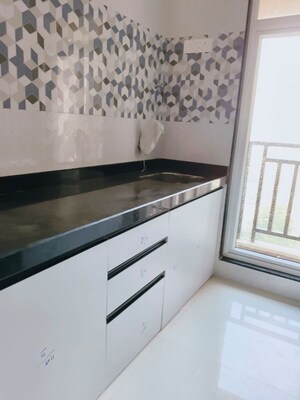 Kitchen in 1 BHK Apartment at Mahavir Kalpavruksha, Ghodbunder Road – for Sale