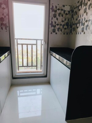 Kitchen in 1 BHK Apartment at Mahavir Kalpavruksha, Ghodbunder Road – for Sale