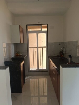 Kitchen in 1 BHK Apartment at Metropolis Bayside, Kasarvadavali – for Rent