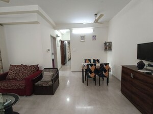 Living Room in 2 BHK Apartment at Metro The Palms, Nerul – for Rent