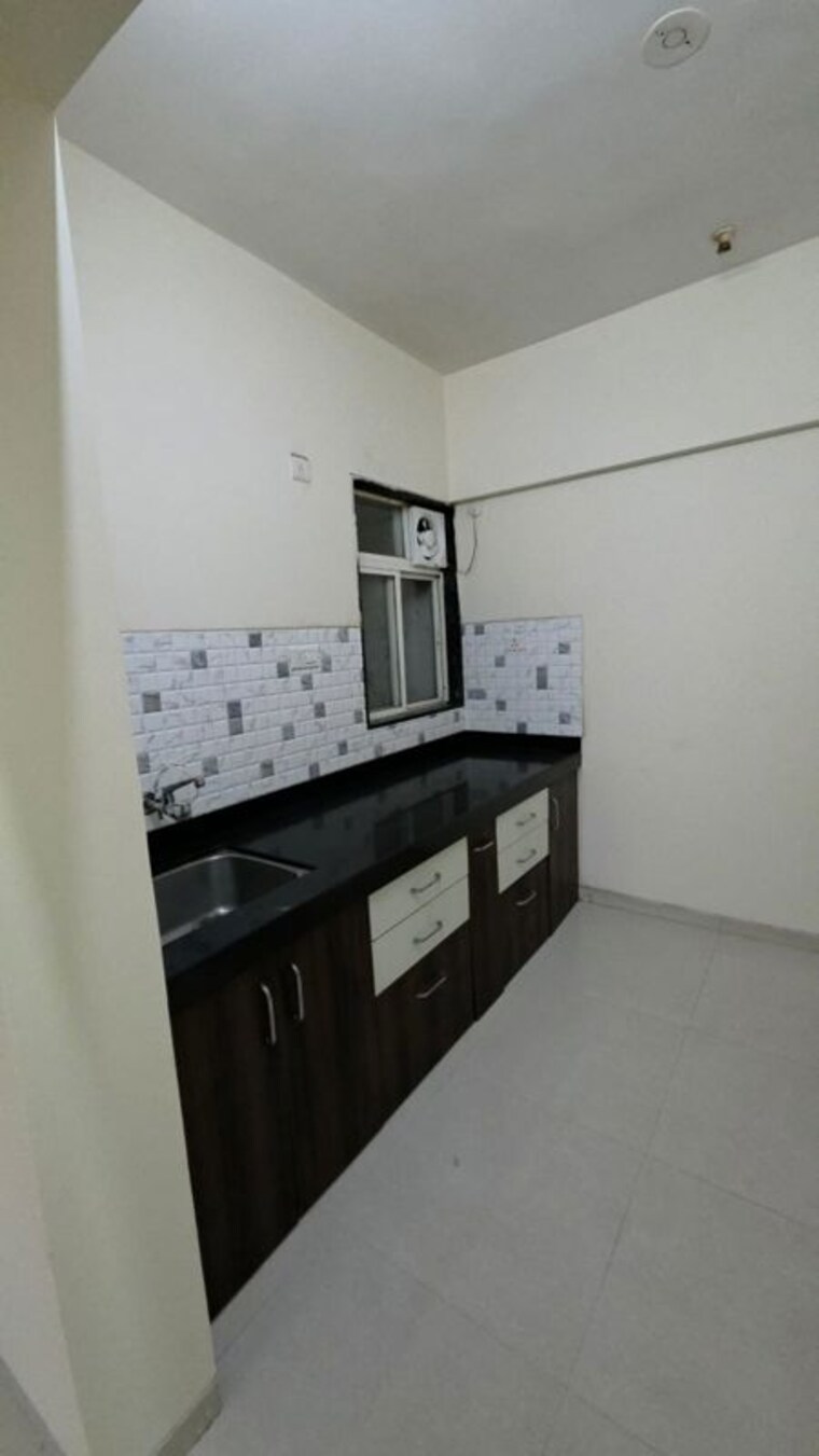 Kitchen, anushree-astral-residency 2 Bedroom 665 Sq.Ft. Apartment In Punawale Pune 10219349