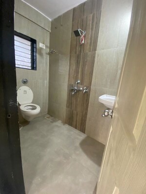 Bathroom in 2 BHK Apartment at Kirtikar CHS, Ganeshwadi – for Rent