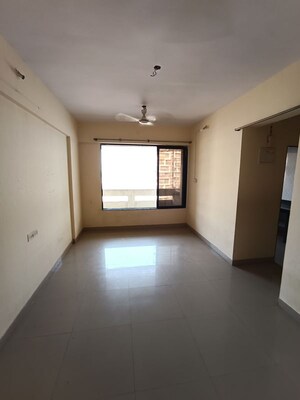 Living Room in 1 BHK Apartment at Ajmera Yogi Dham Phase III, Kalyan West – for Sale