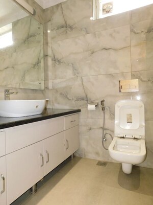 Bathroom in 3 BHK Apartment at Jor Bagh – for Rent