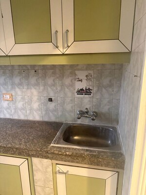 Bathroom in 4 BHK Apartment at Vasant Vihar – for Sale