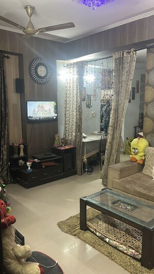 Living Room in 2 BHK Apartment at Crossing Republik, Crossing Republic – for Sale