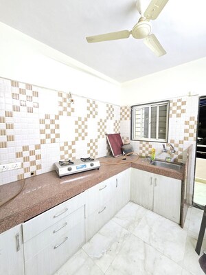 Kitchen in 2 BHK Apartment at Wadgaon Sheri – for Rent